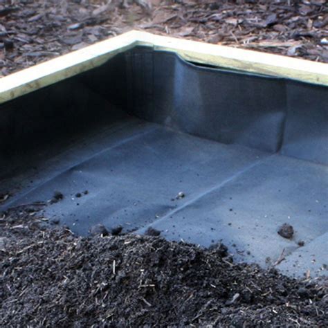 liner for metal planter box to protect plants from burning|lining a garden metal planter.